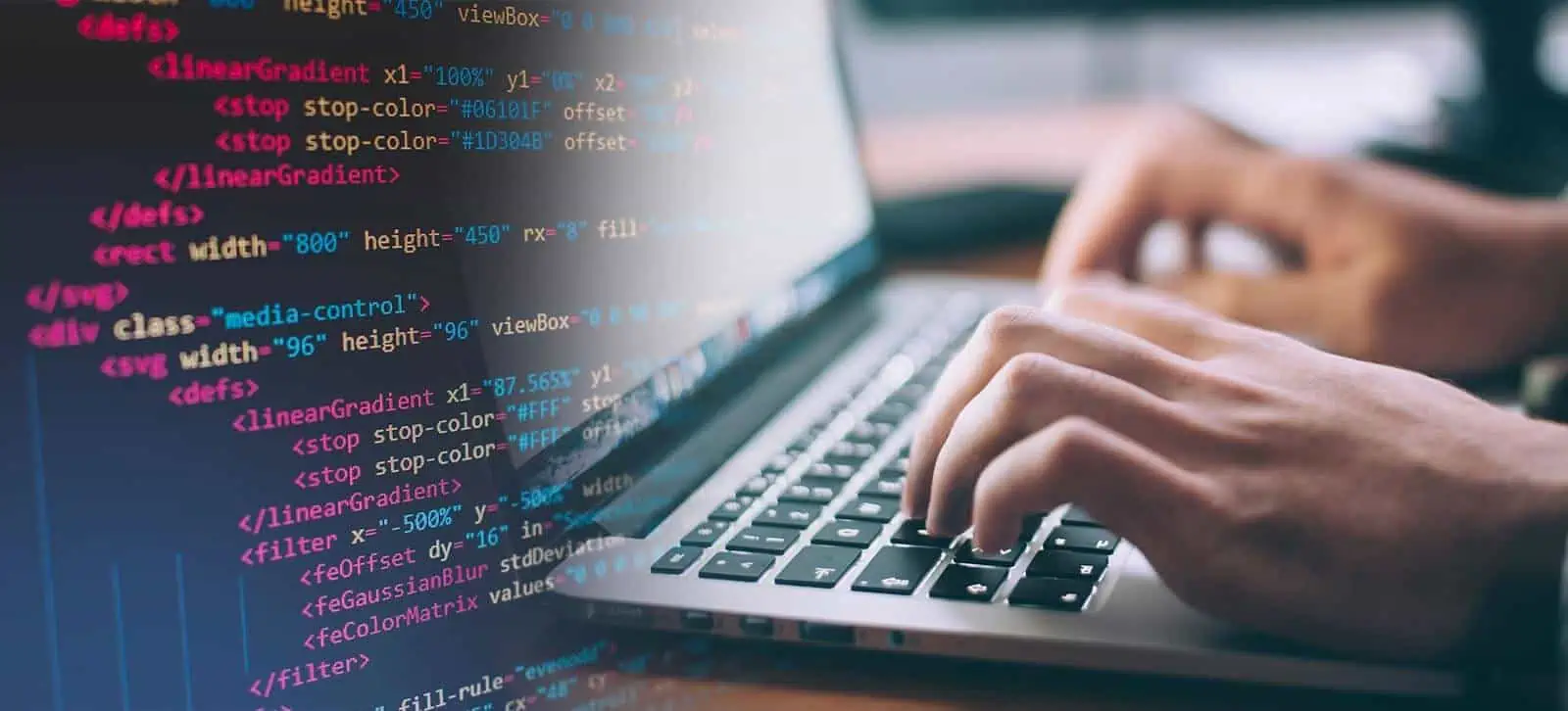 picture of hands typing html and php code on a computer representing website maintenance