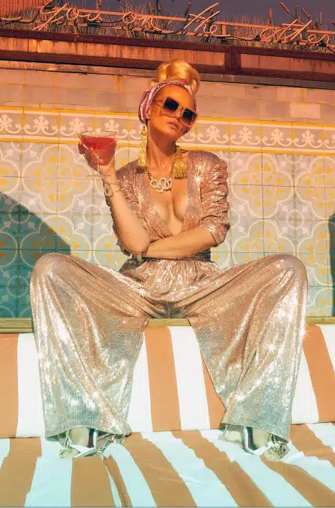 woman in glittery attire showing off at a party